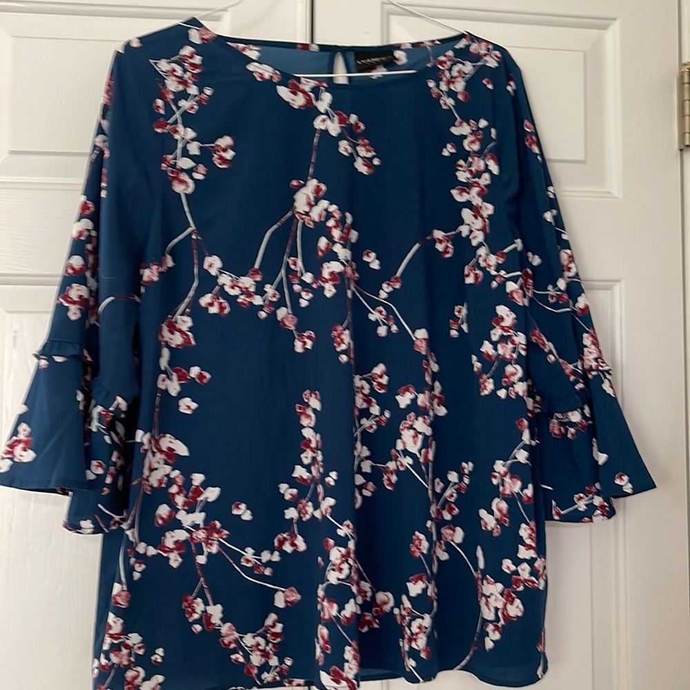 Lane Bryant blouse. Easy wear out of the dryer. Pretty ruffle detail on sleeve.